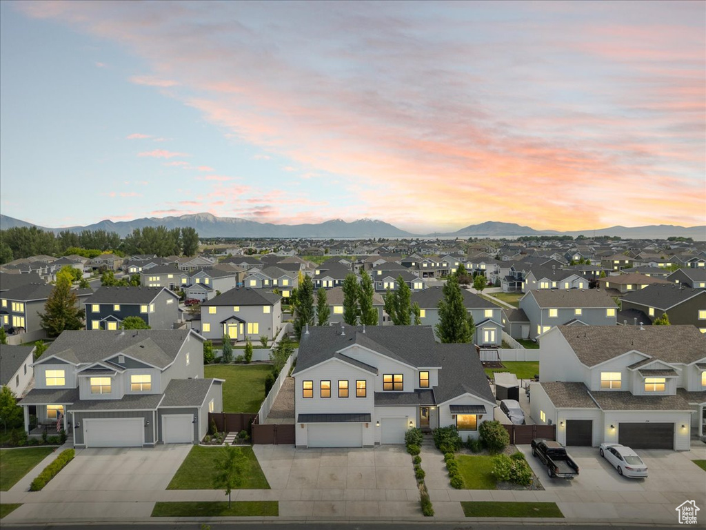 Aerial view of residential area featuring a mountainous background