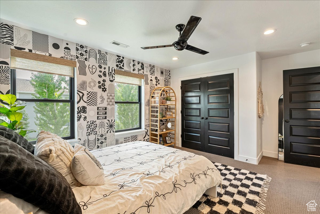 Bedroom featuring recessed lighting, baseboards, carpet flooring, arched walkways, and a ceiling fan