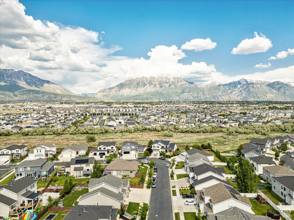 Aerial view of residential area featuring a mountainous background
