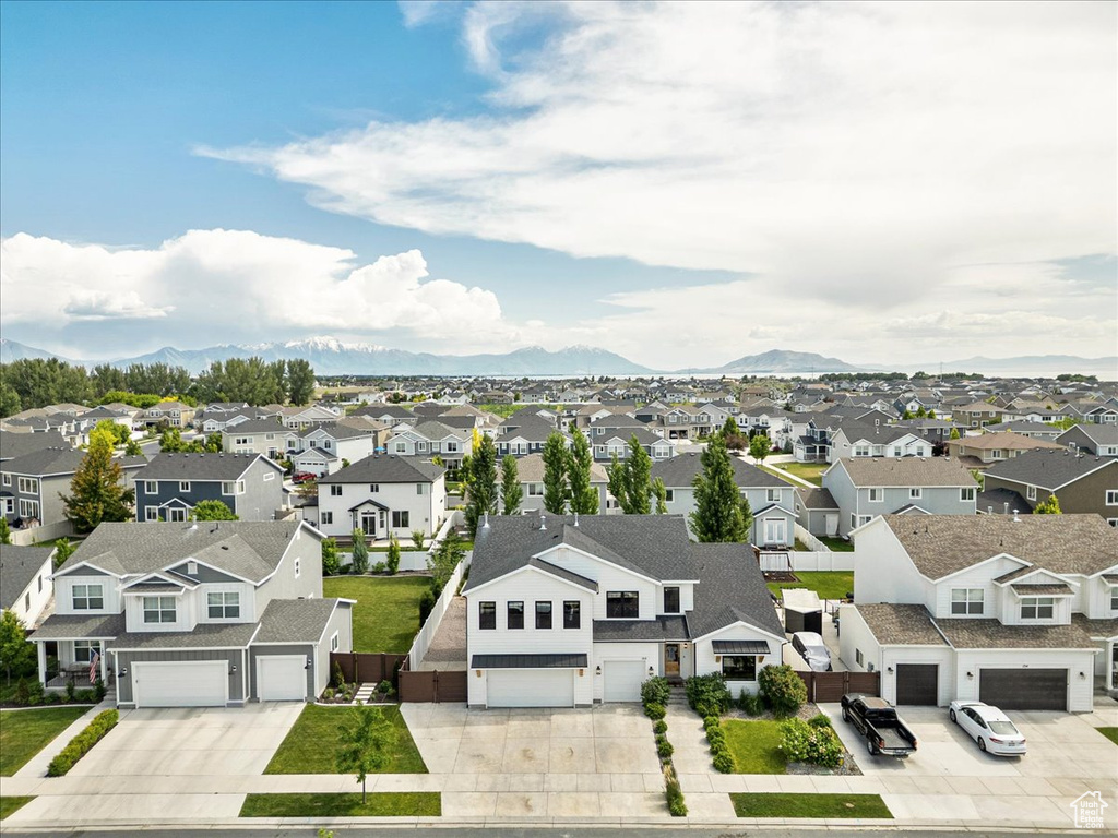 Aerial view of residential area featuring mountains