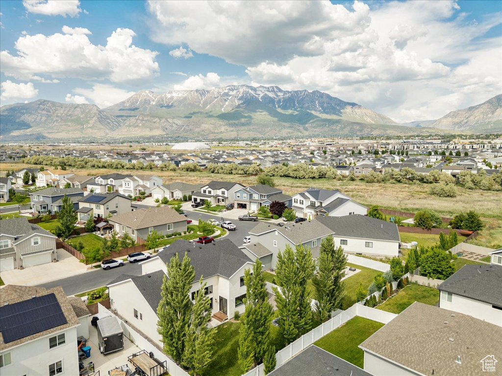 Aerial perspective of suburban area featuring a mountain backdrop