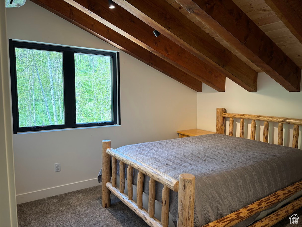 Carpeted bedroom featuring baseboards