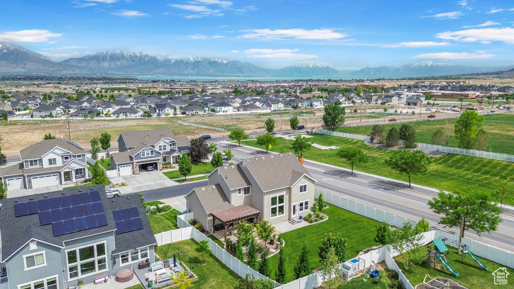Aerial perspective of suburban area with a mountainous background