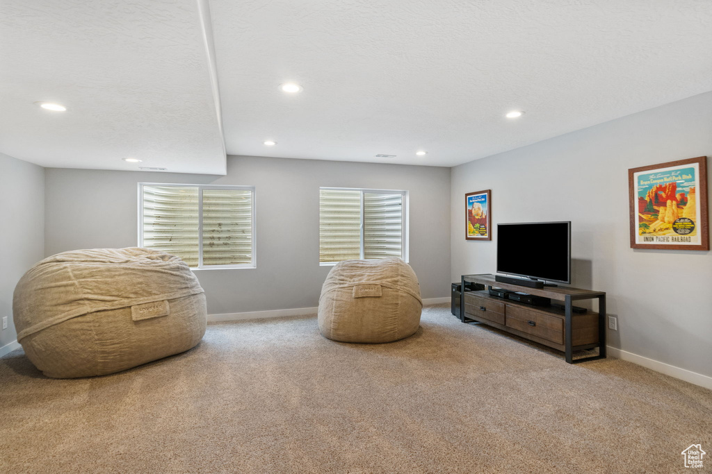Sitting room with carpet floors, recessed lighting, and baseboards