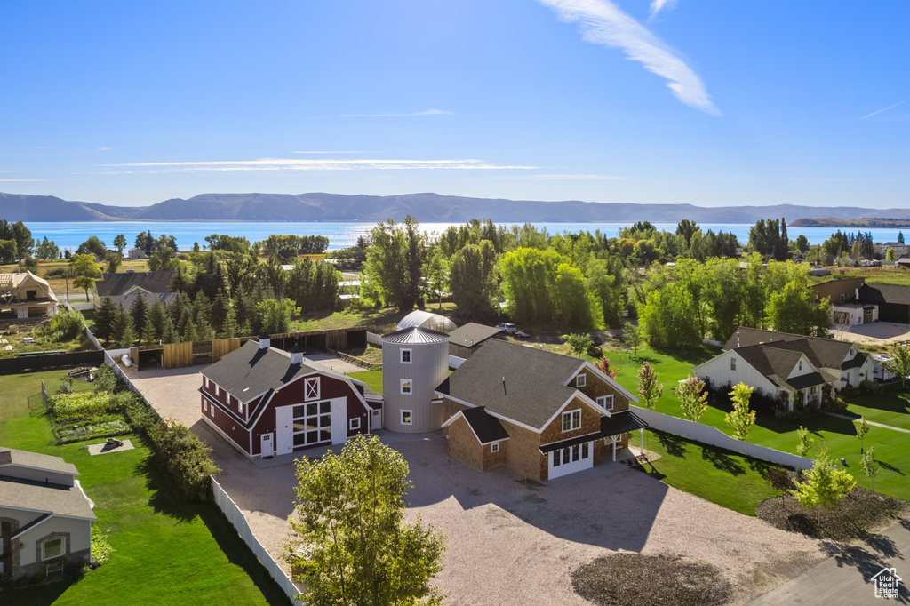 Aerial view of residential area featuring a water and mountain view