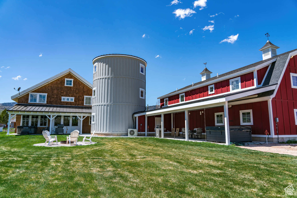 View of building exterior with a fire pit