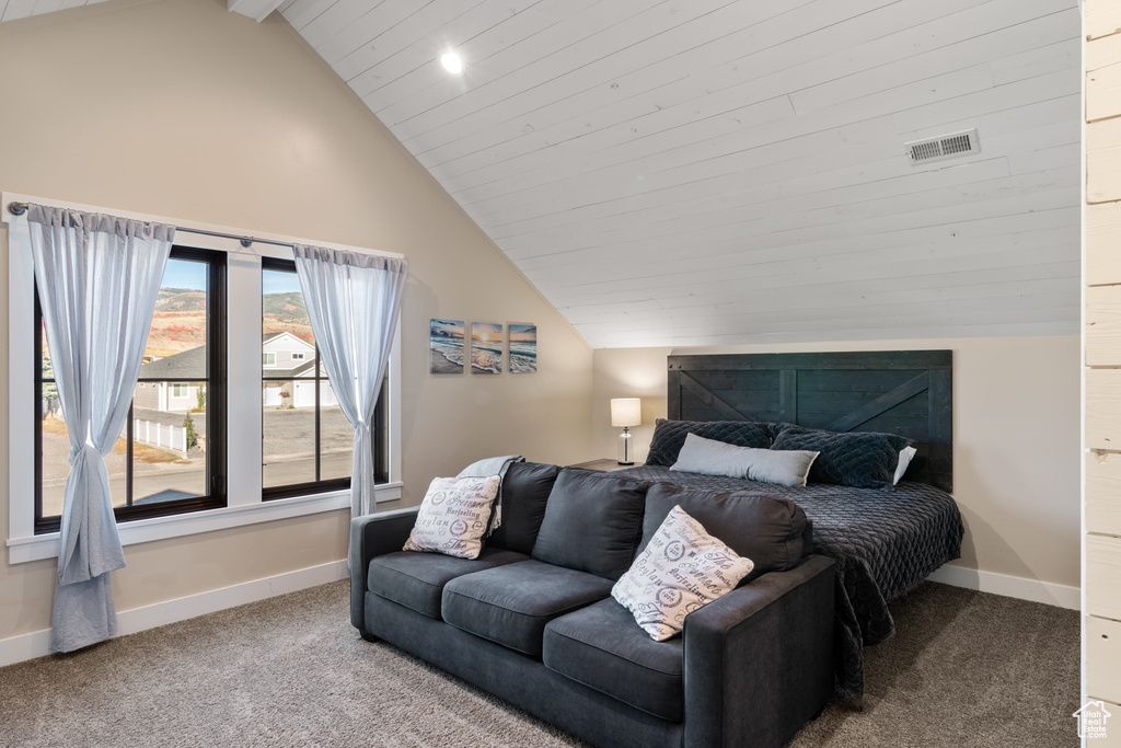 Bedroom with lofted ceiling, carpet, baseboards, and recessed lighting