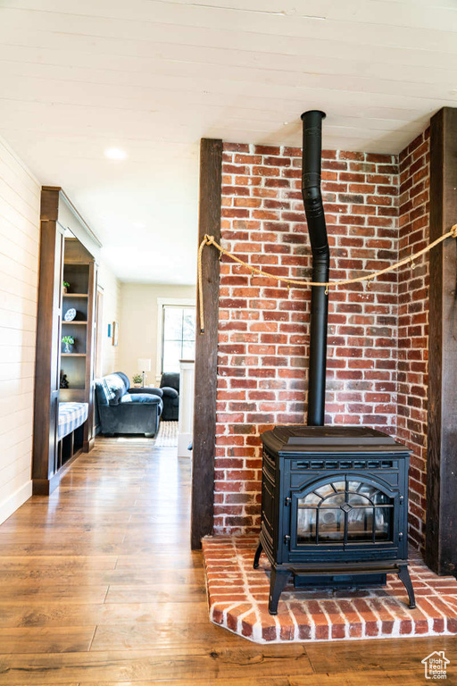 Detailed view of a wood stove and wood finished floors