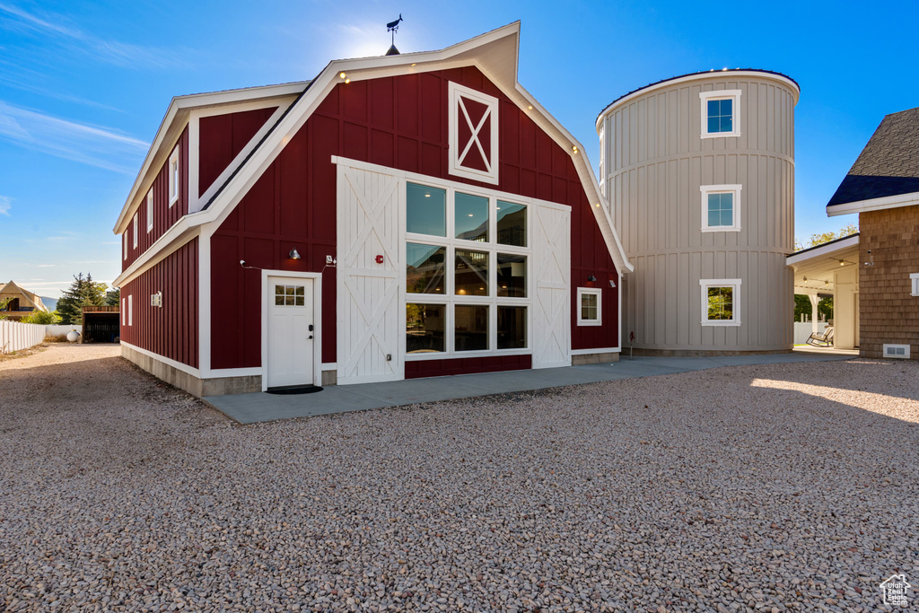 View of building exterior with a barn