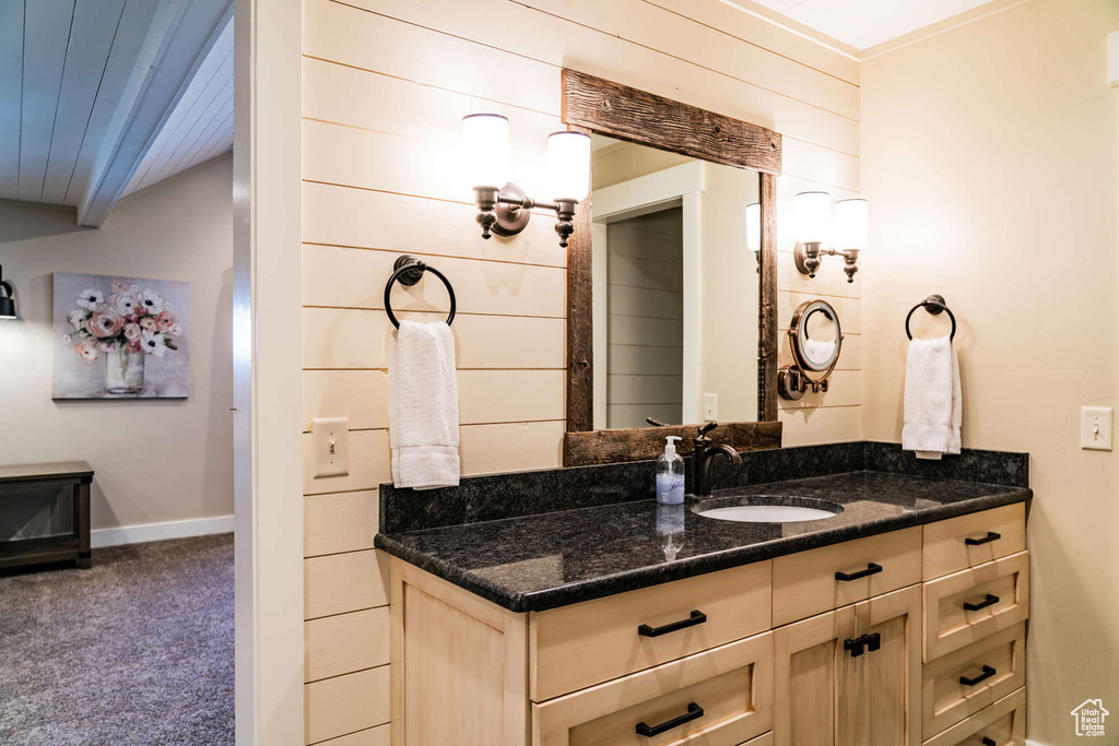 Bathroom featuring vanity and baseboards