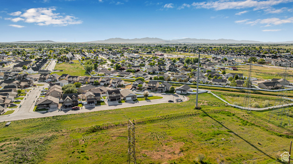 Aerial view of residential area featuring a mountain backdrop