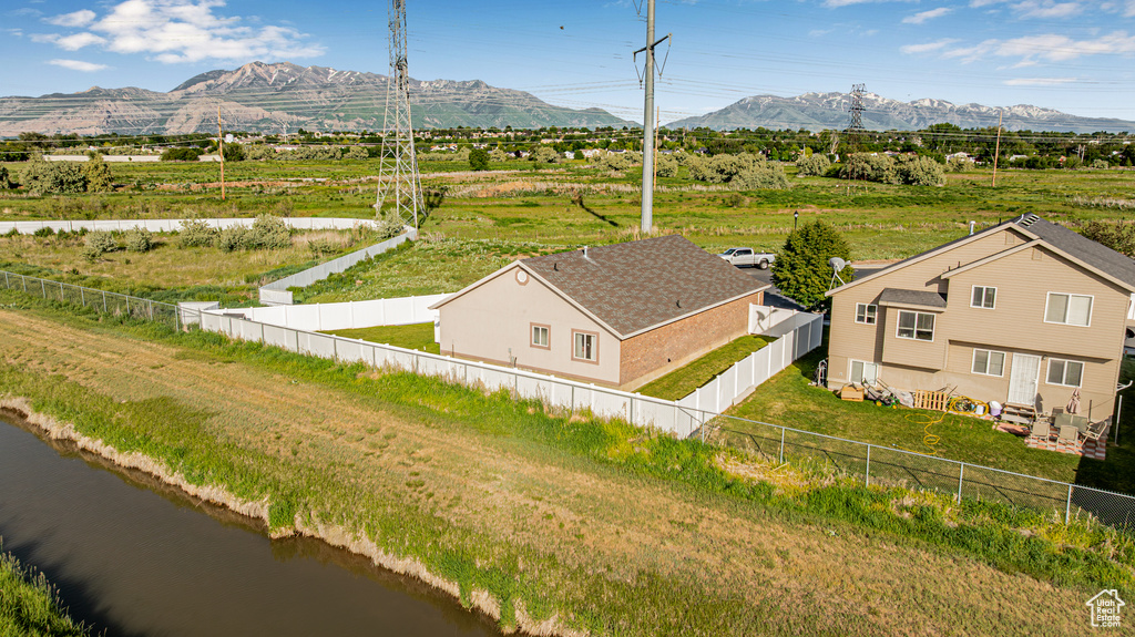 Overview of rural landscape featuring a mountain backdrop