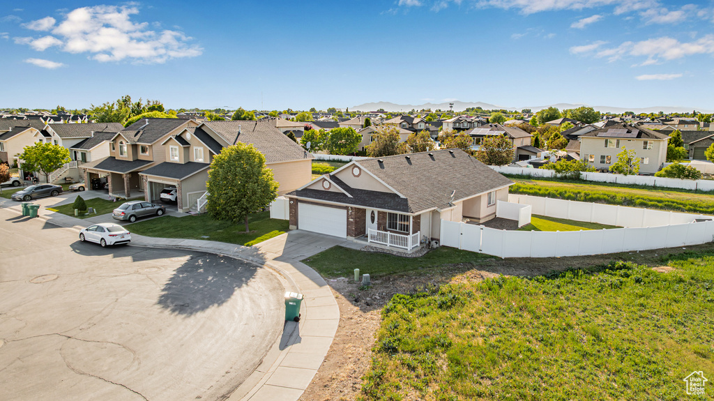Aerial view of residential area with a mountainous background
