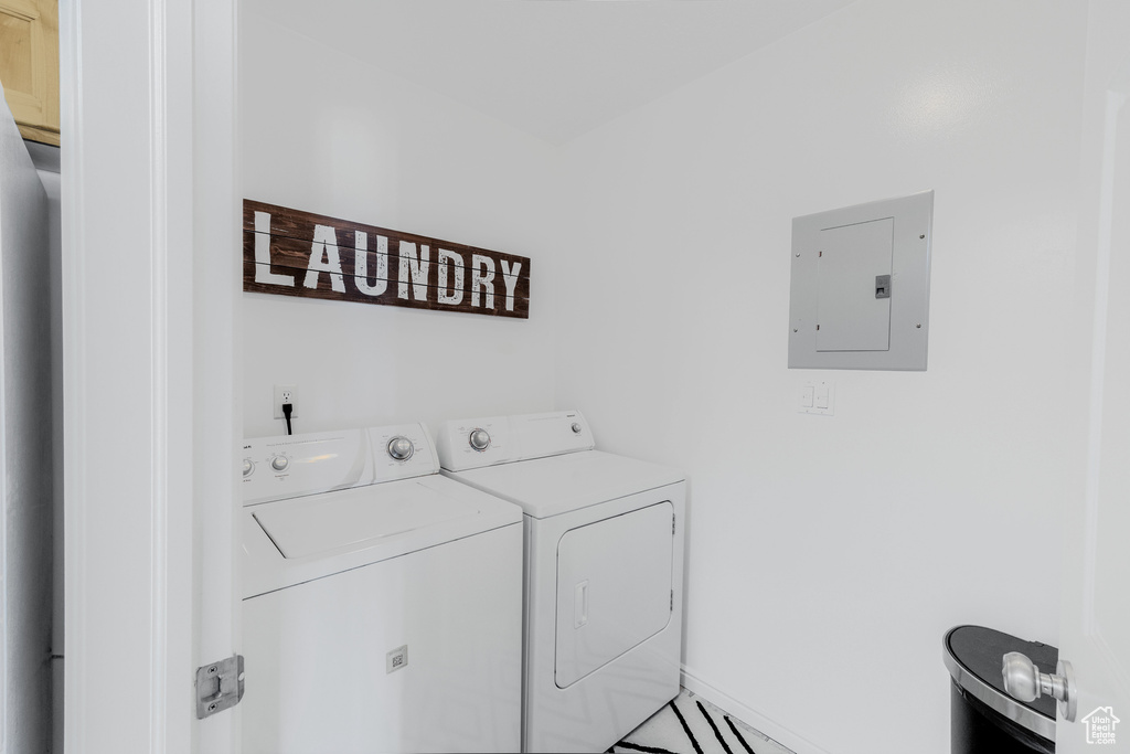 Laundry area with electric panel and independent washer and dryer