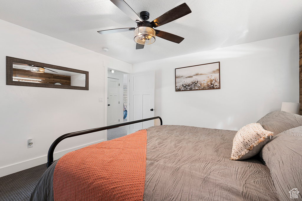 Bedroom featuring baseboards and ceiling fan
