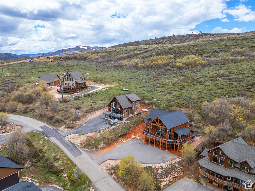 View from above of property with a mountain backdrop