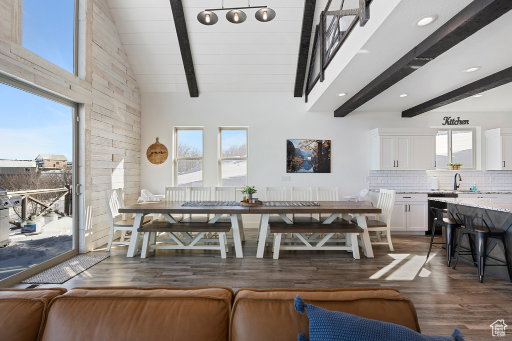 Dining space featuring dark wood finished floors and recessed lighting