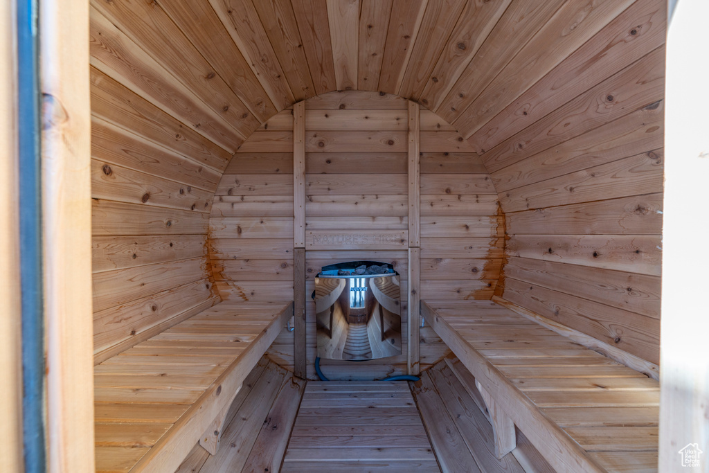 Sauna with wood walls and wood ceiling