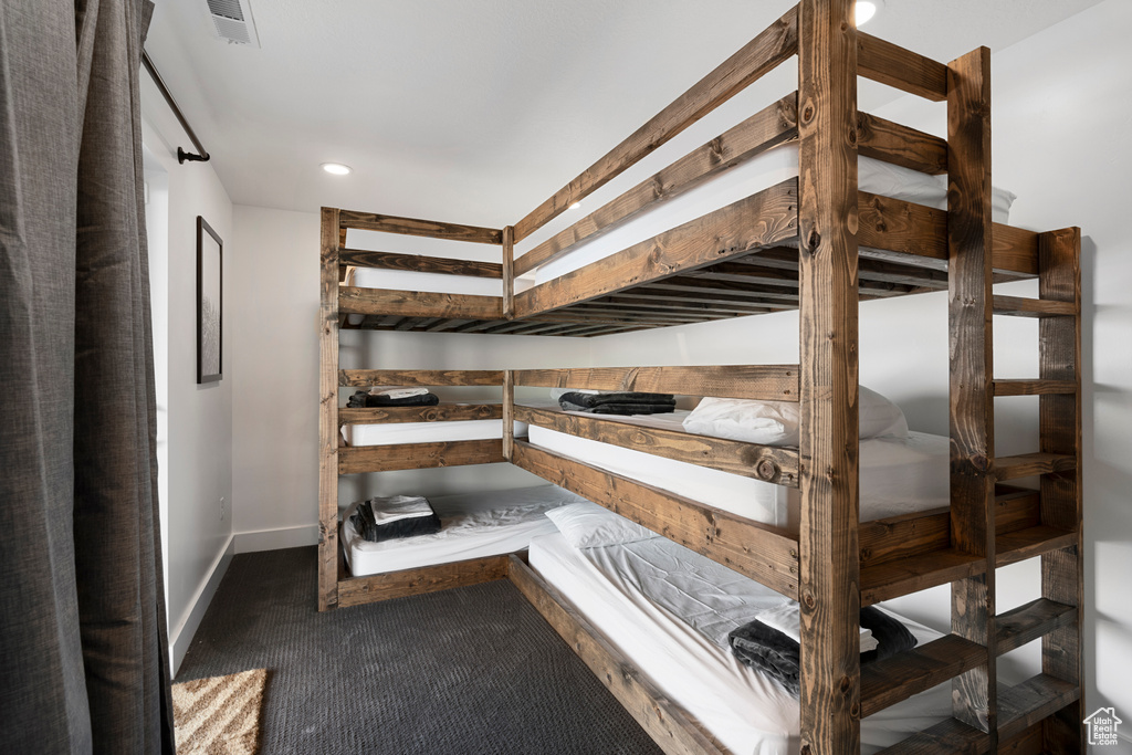 Bedroom with carpet flooring, baseboards, and recessed lighting
