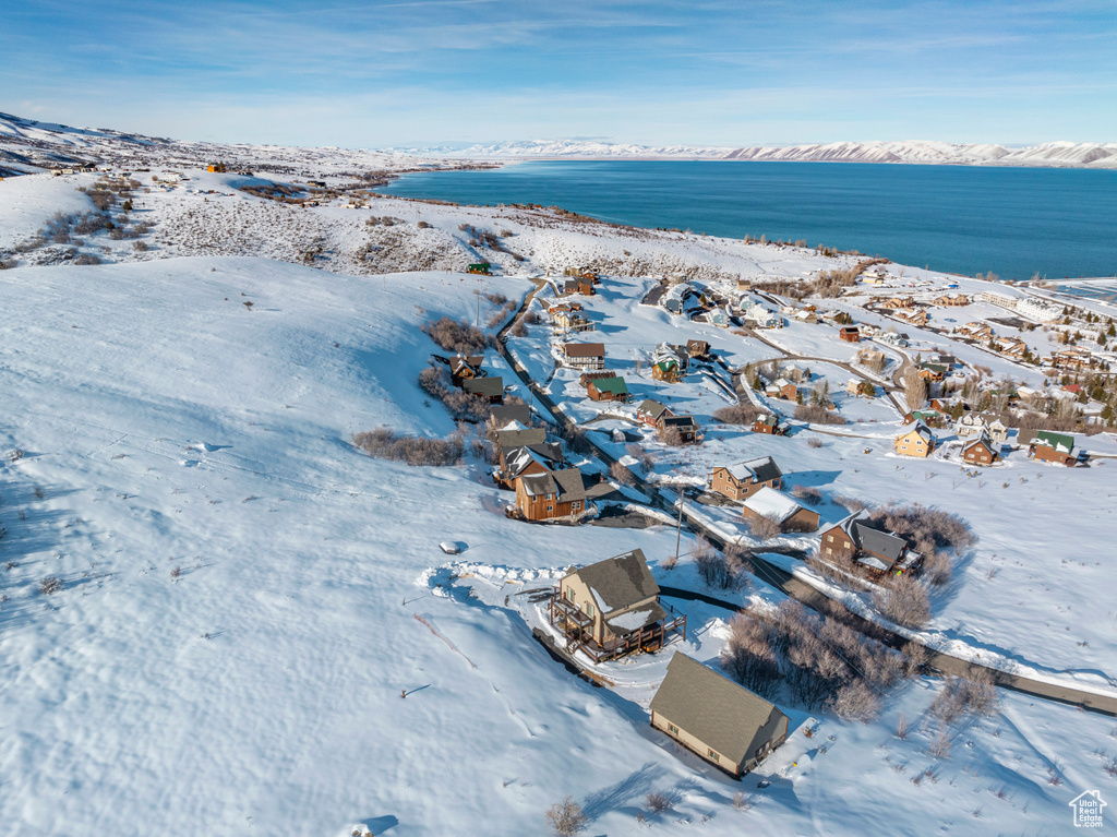Aerial overview of property\'s location with a nearby body of water