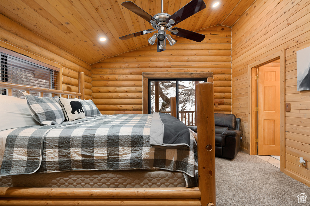 Carpeted bedroom with lofted ceiling, wood ceiling, rustic walls, recessed lighting, and access to outside