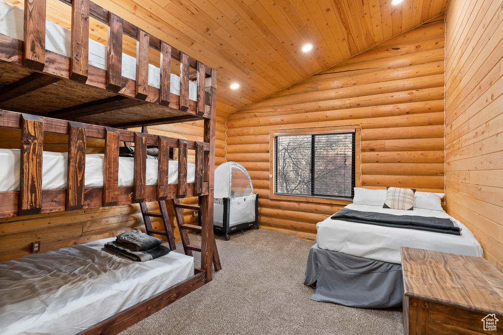 Bedroom featuring wood ceiling, recessed lighting, carpet, high vaulted ceiling, and log walls