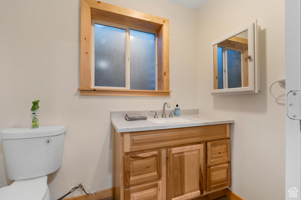 Bathroom featuring toilet and vanity