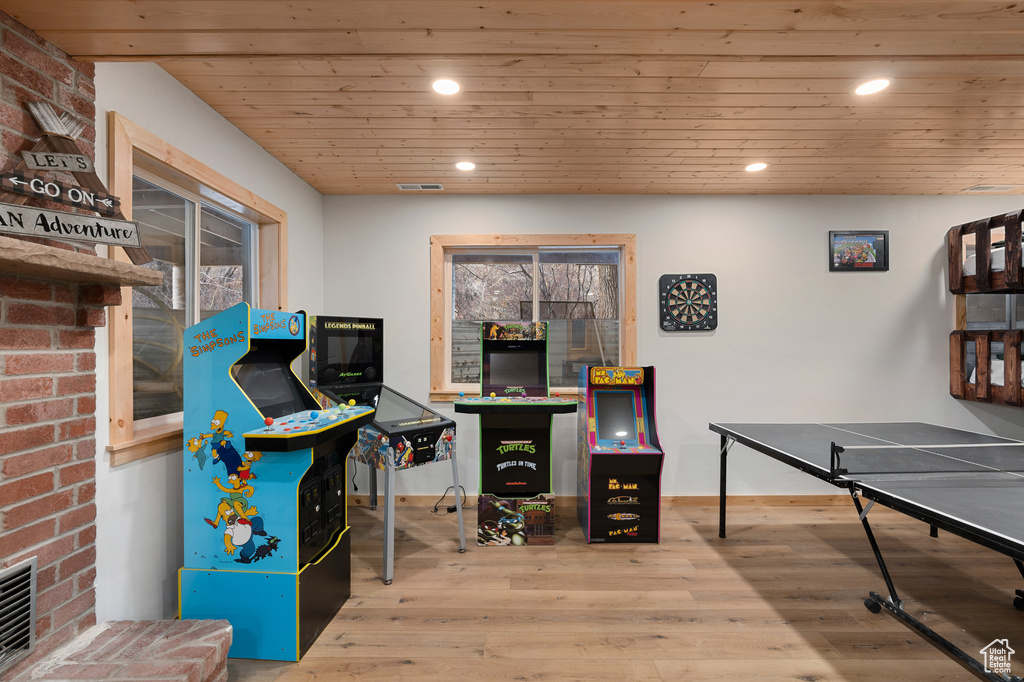 Playroom with wood finished floors, wooden ceiling, and recessed lighting