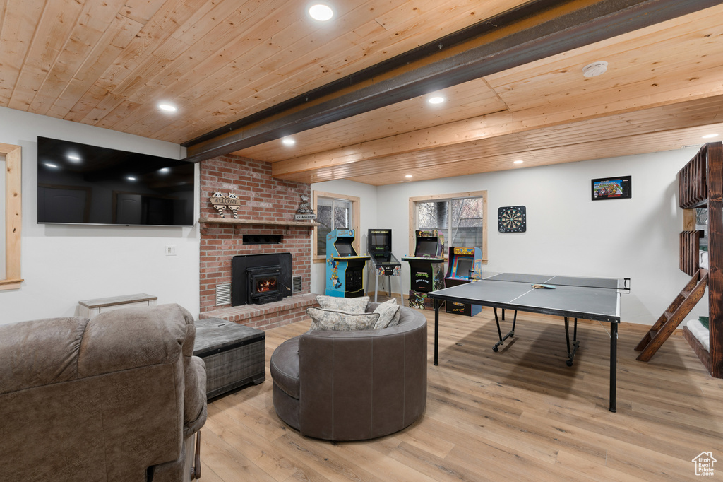 Living area with wood ceiling, recessed lighting, and light wood finished floors