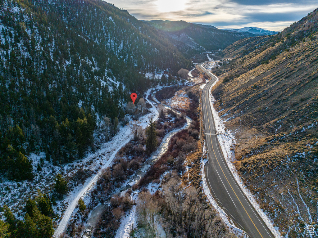 Aerial overview of property's location featuring a mountain backdrop