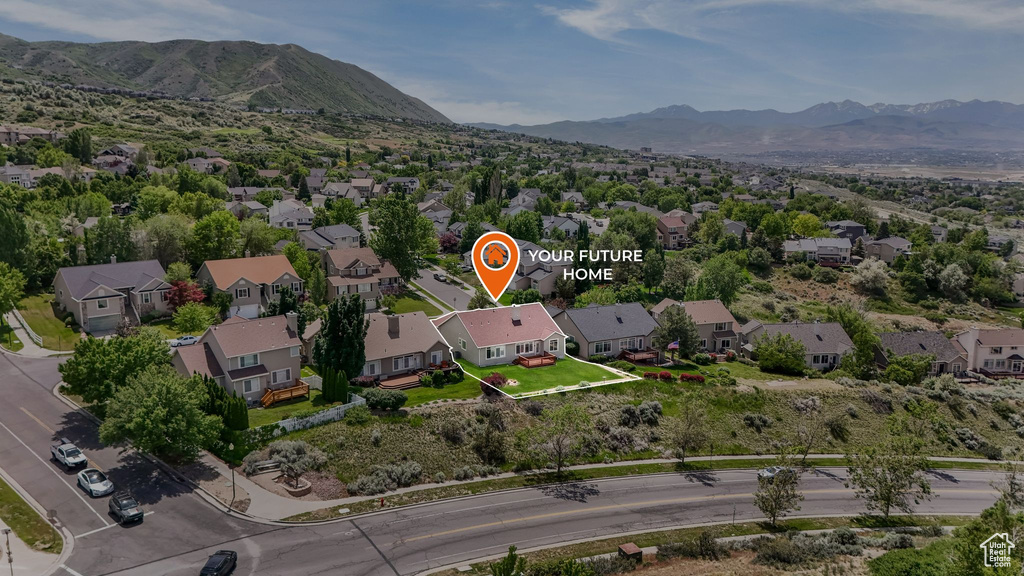 Aerial view of residential area with a mountainous background