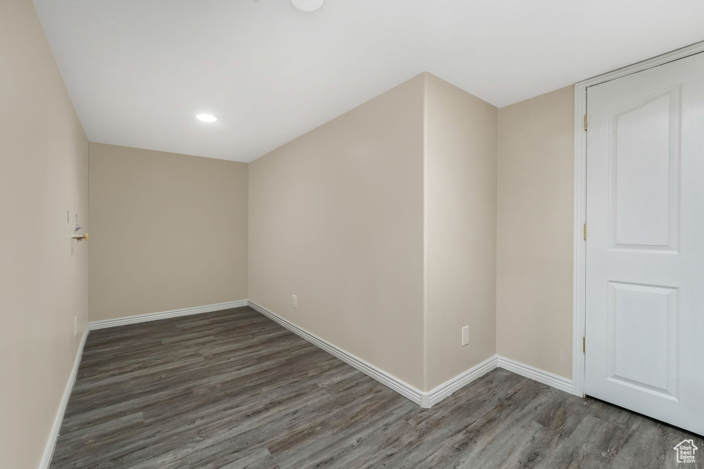 Bonus room featuring wood finished floors, baseboards, and recessed lighting