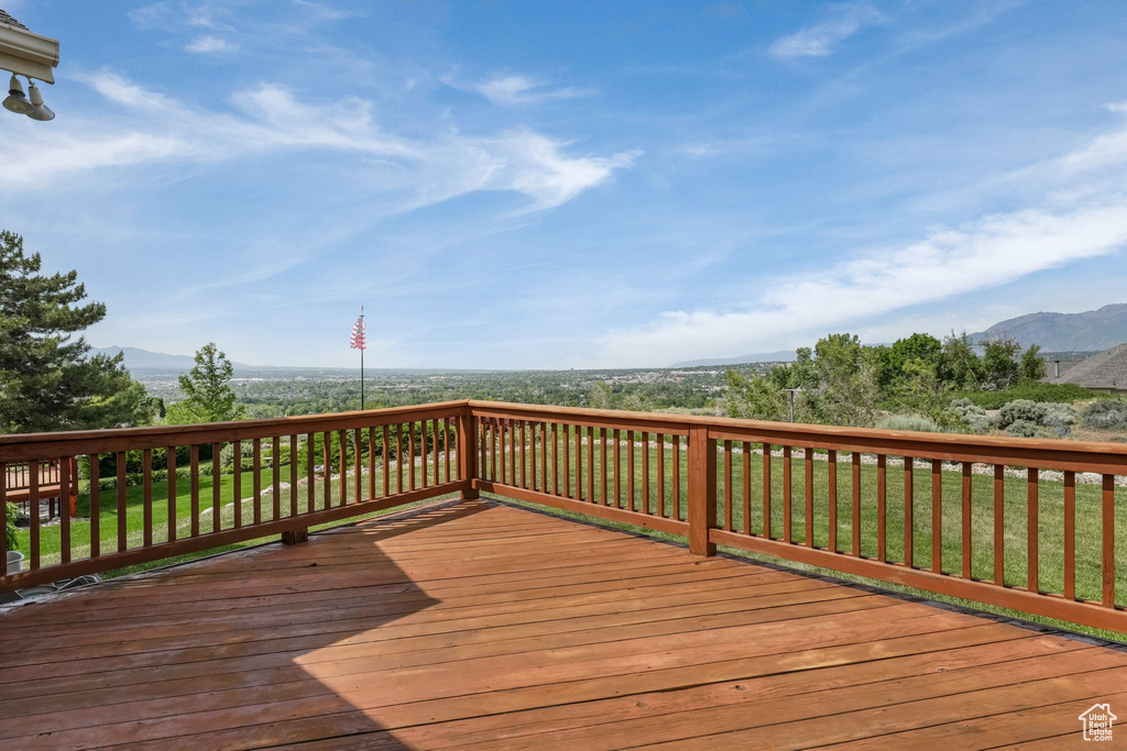 Wooden terrace featuring a mountain view