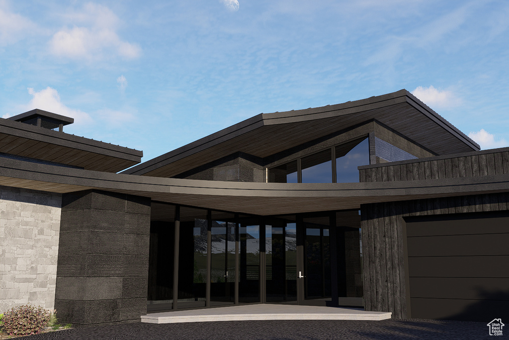 Rear view of house featuring a garage