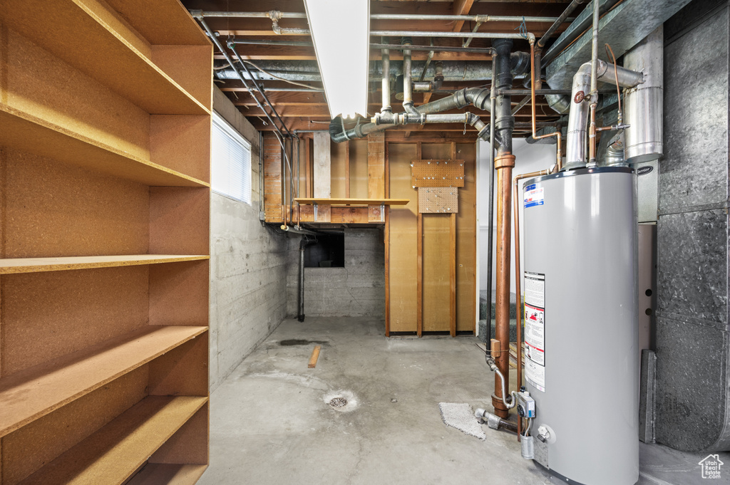 Below grade area featuring gas water heater