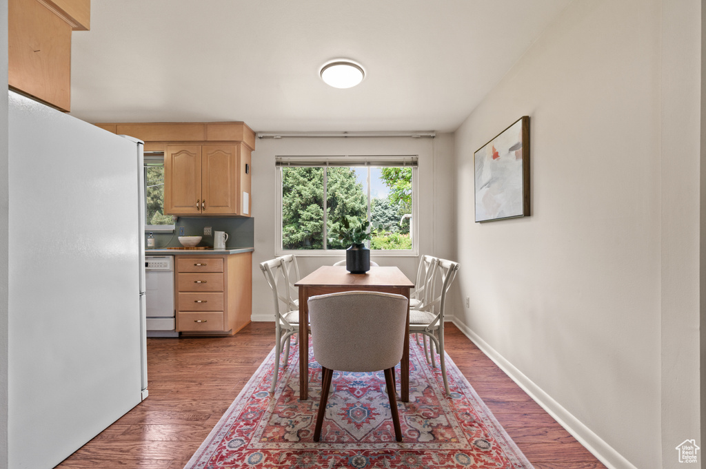 Dining room featuring wood finished floors and baseboards