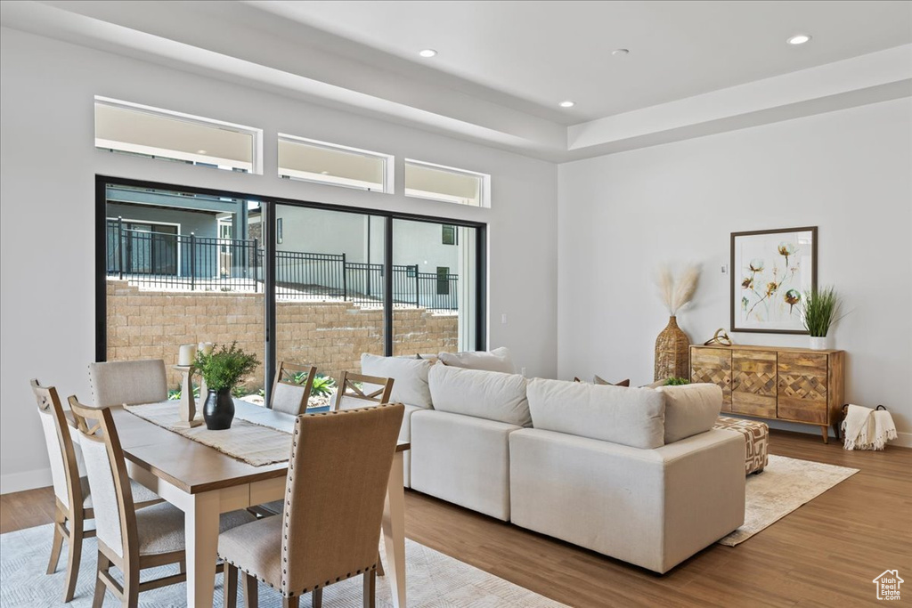 Dining space featuring wood finished floors and recessed lighting
