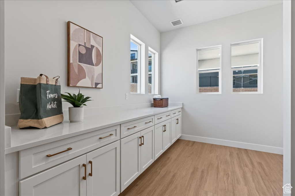 Detailed view of wood finished floors and baseboards