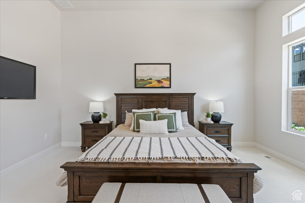 Carpeted bedroom with baseboards