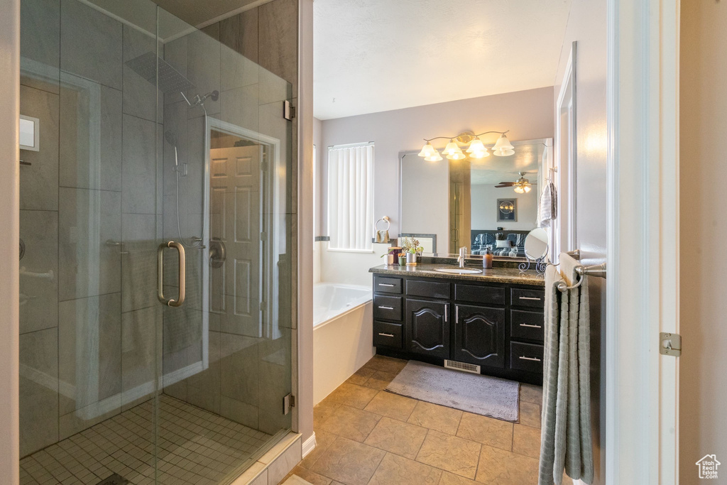 Full bath with vanity, a garden tub, a shower stall, and ceiling fan