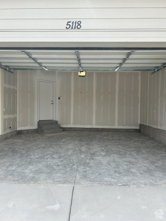Garage featuring a garage door opener