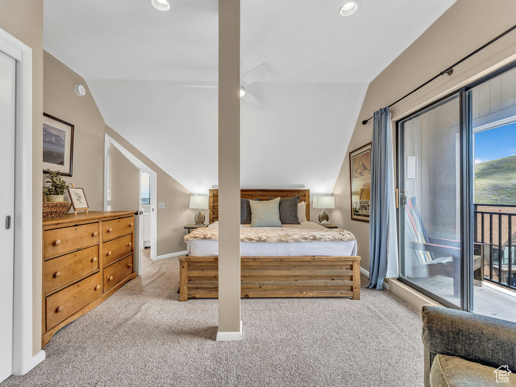 Bedroom featuring lofted ceiling, access to exterior, light carpet, baseboards, and recessed lighting