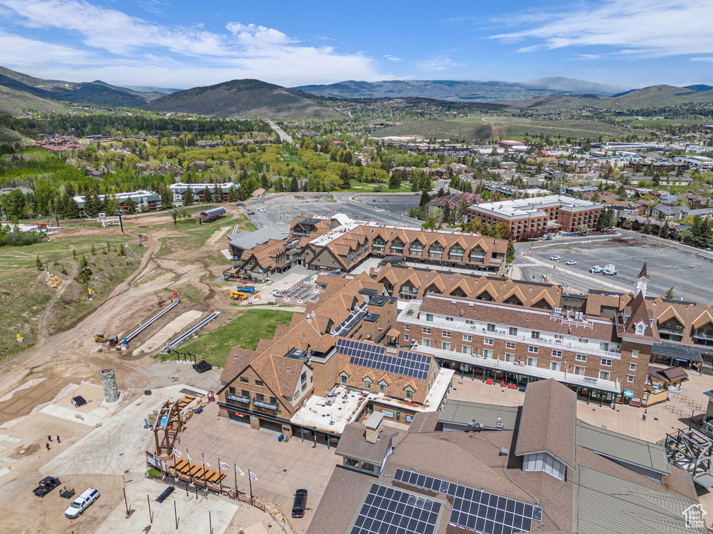 Aerial overview of property\'s location featuring a mountainous background