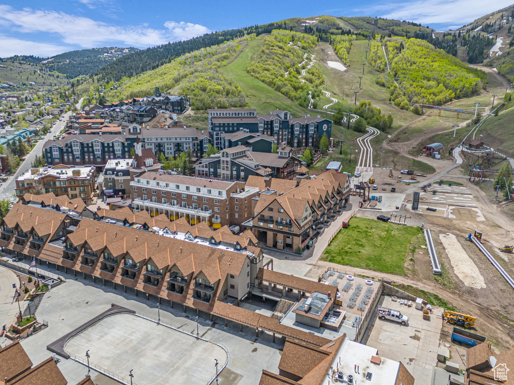 Aerial view of property\'s location featuring mountains and a forest