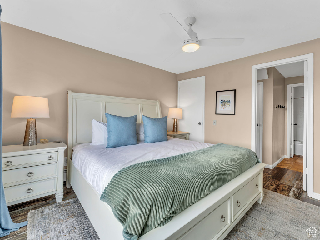 Bedroom featuring wood finished floors, baseboards, and ceiling fan