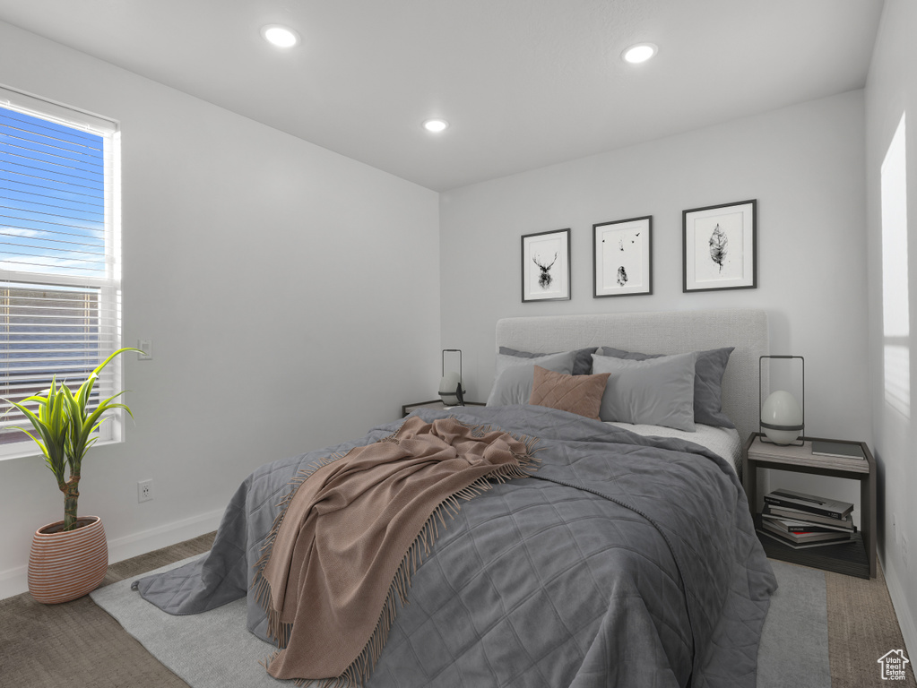 Bedroom with recessed lighting and baseboards