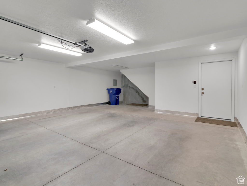 Garage featuring a garage door opener