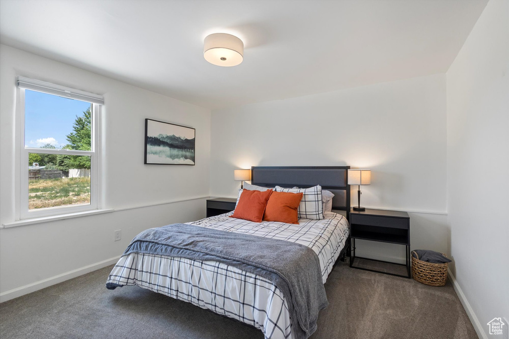 Carpeted bedroom with baseboards