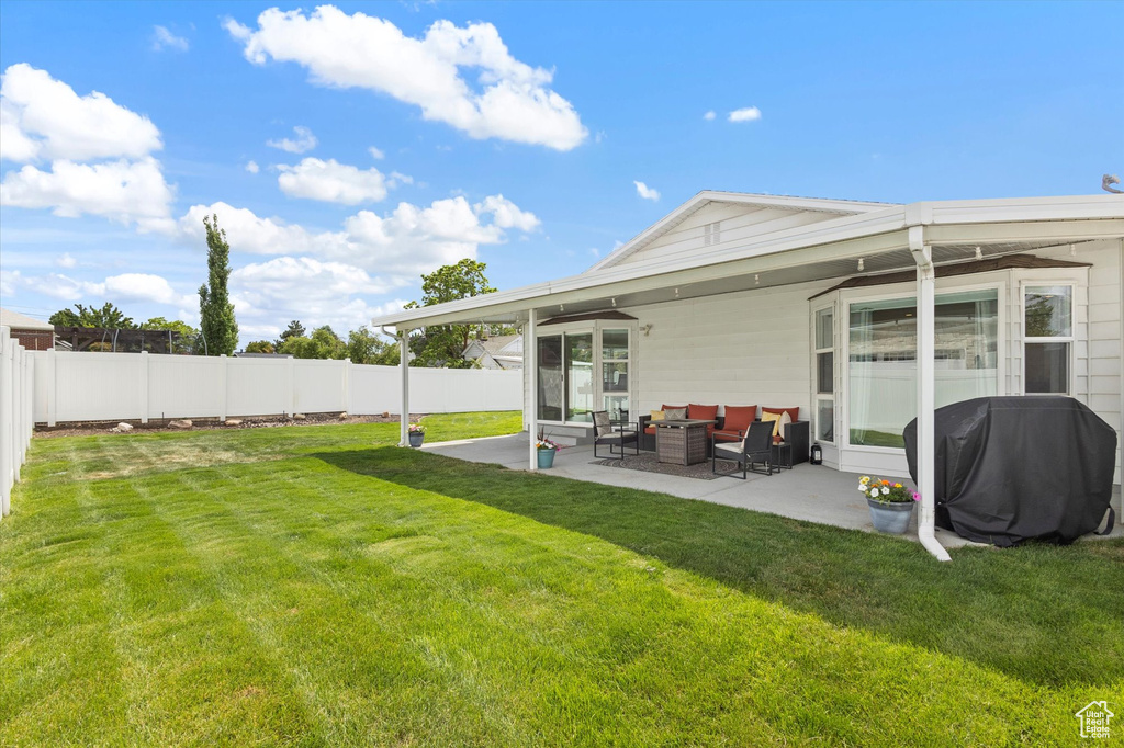 View of yard featuring a patio and outdoor lounge area