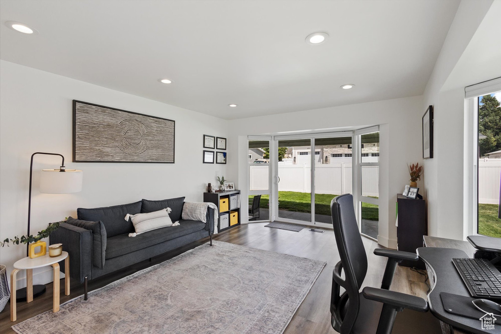 Office area with wood finished floors and recessed lighting